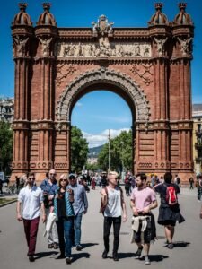 People on Park Passing Concrete Gate